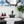 Load image into Gallery viewer, marble soap dish scalloped for large 6oz bar soap in a beautiful farmhouse bathroom with wainscoting and blue floral wallpaper black faucet and old black dresser sink. essential oil liquid soap and lotion and an ikat blue and white turkish cotton hand towel