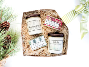 Christmas Gift Box Candles and Soaps in Frasier fir scent and pumpkin spice with orange clove soap and pine tree bar soap in a white gift basket with ribbon green
