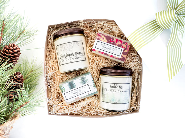 Christmas Gift Box Candles and Soaps in Frasier fir scent and pumpkin spice with orange clove soap and pine tree bar soap in a white gift basket with ribbon green